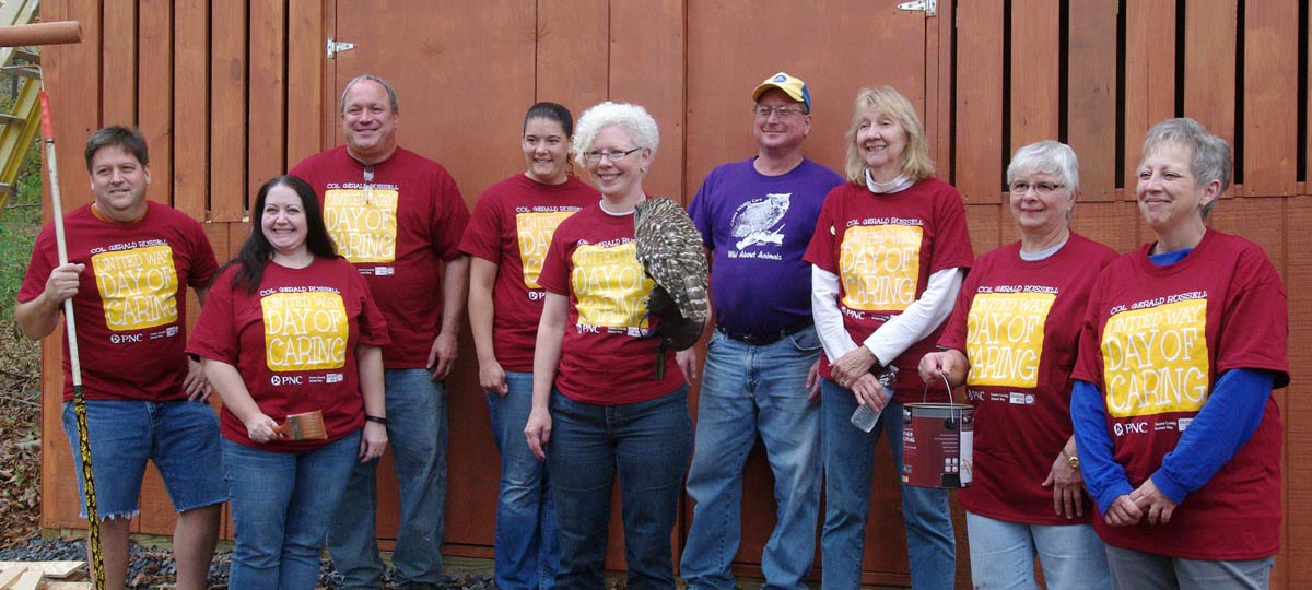 AJ Saclyn, Sara Eyster, Tracey Peters, Christina Hill, Robyn (holding Aurora the barred owl), Randy Romesberg, Jennifer Mastrofski, Roberta Scott, and Tawnya Childs